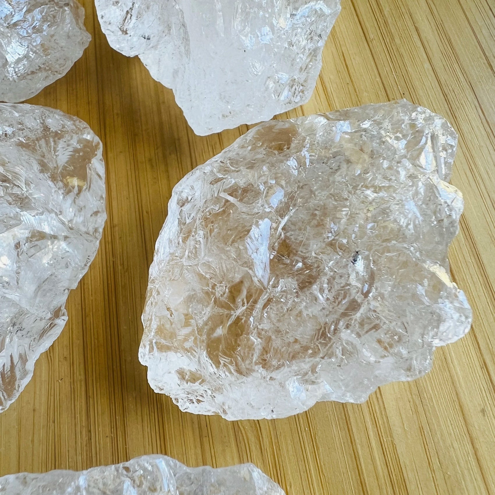 Side profile of Grade AA Clear Quartz raw stone, often worked with for Cleansing, sourced from Brazil.