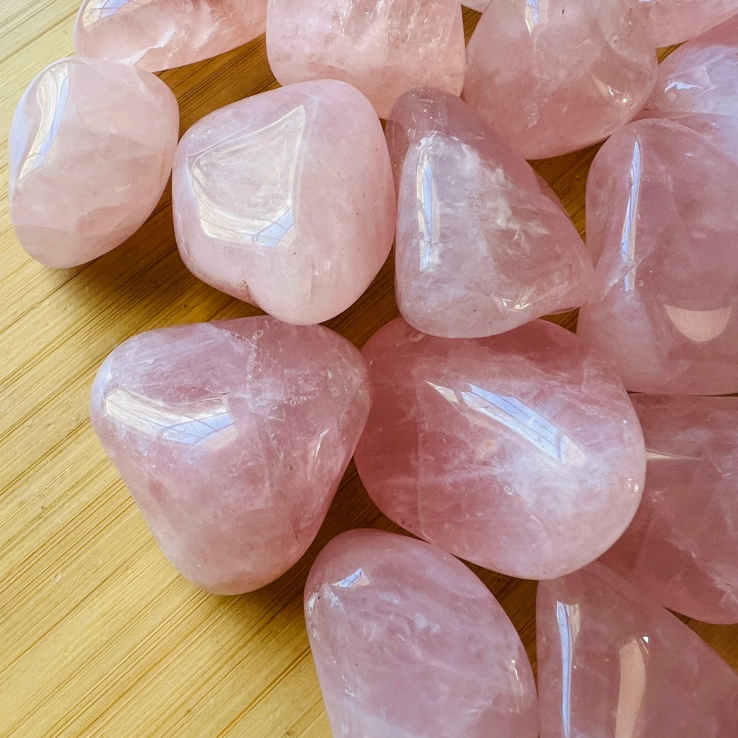 Top view of Grade AA Rose Quartz tumbled stone, sourced from Minas Gerais, Brazil