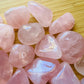 Alternate angle of Grade AA Rose Quartz tumbled stone showing overall shape