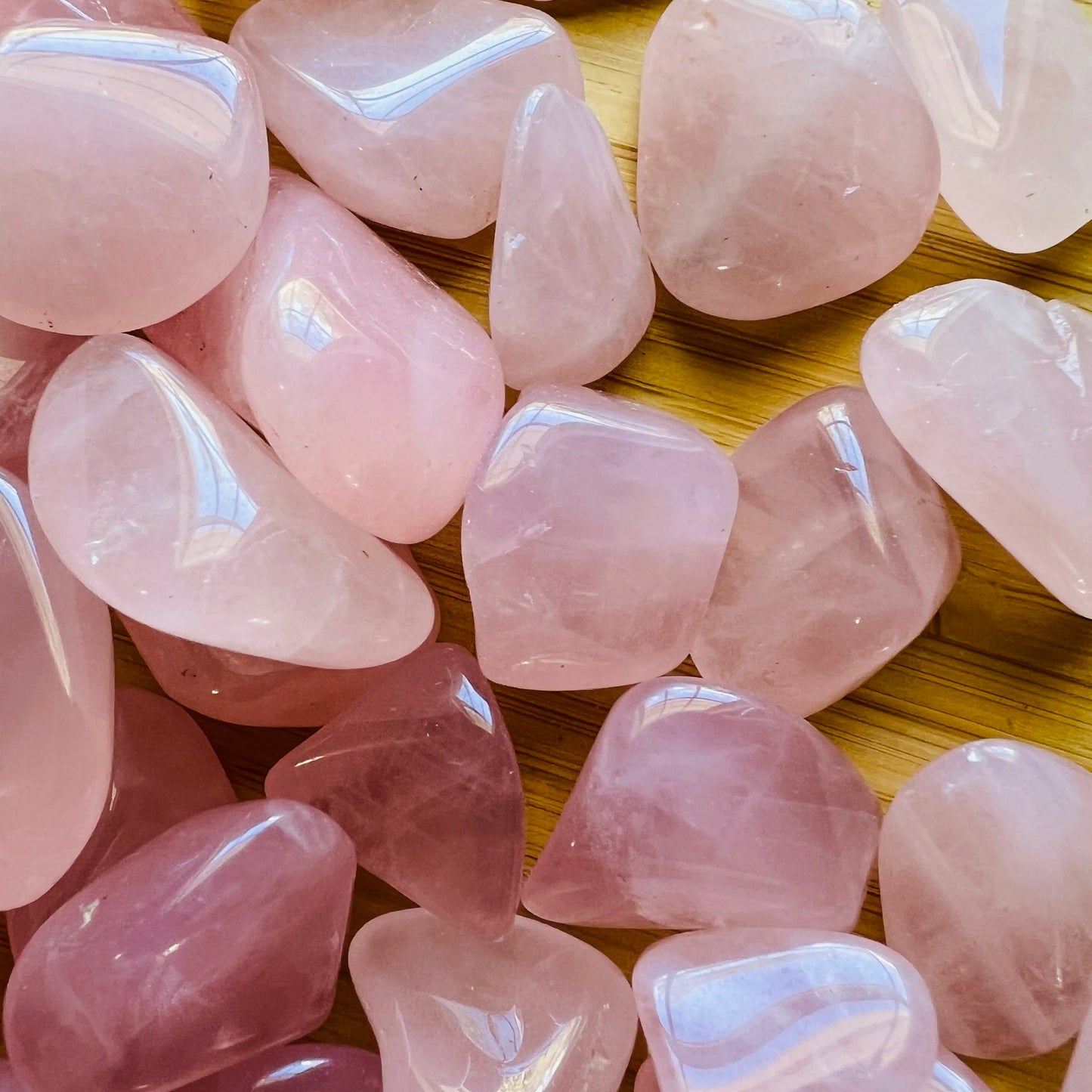 Overhead angle of Rose Quartz tumbled stone, showing characteristic color, often paired with practices around Love.