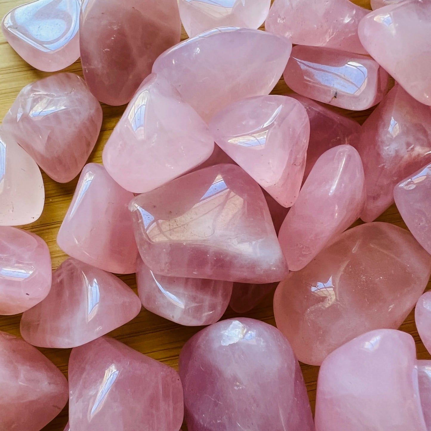 Underside detail of Grade AA Rose Quartz tumbled stone, sourced from Madagascar.