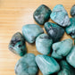 Reverse side of Emerald tumbled stone, showing characteristic color.