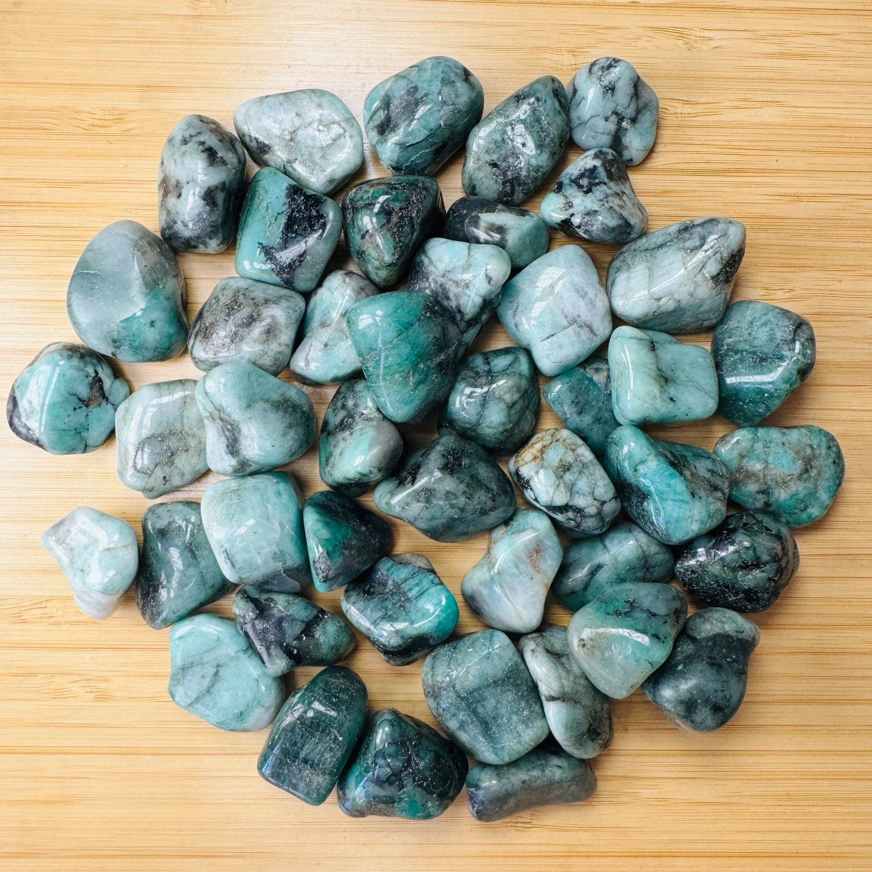 Emerald tumbled stone from Brazil with Green color, polished finish for mindful calm