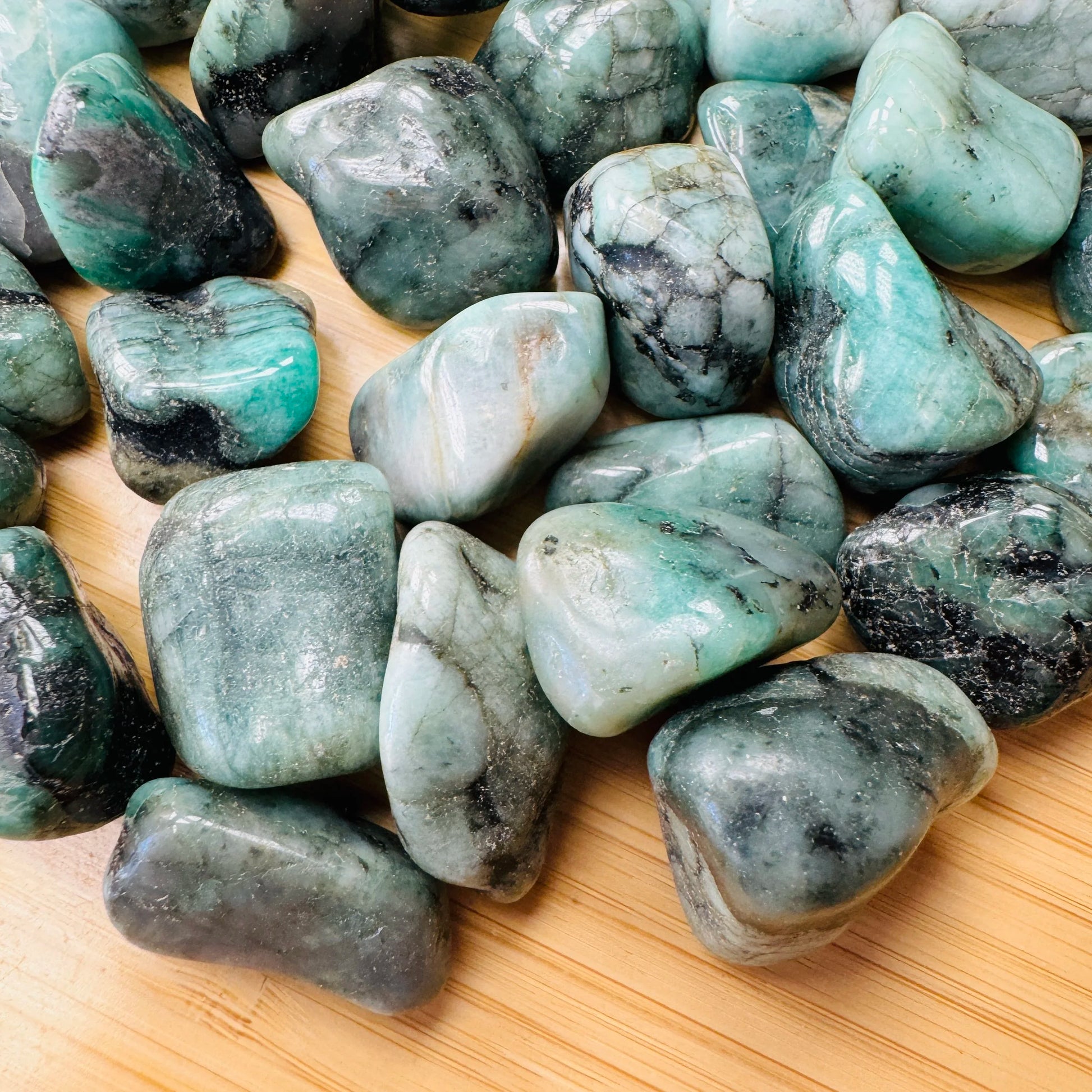 Full profile of Grade AA Emerald tumbled stone ready to ship from Beyond Bohemian
