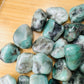Full profile of Grade AA Emerald tumbled stone ready to ship from Beyond Bohemian