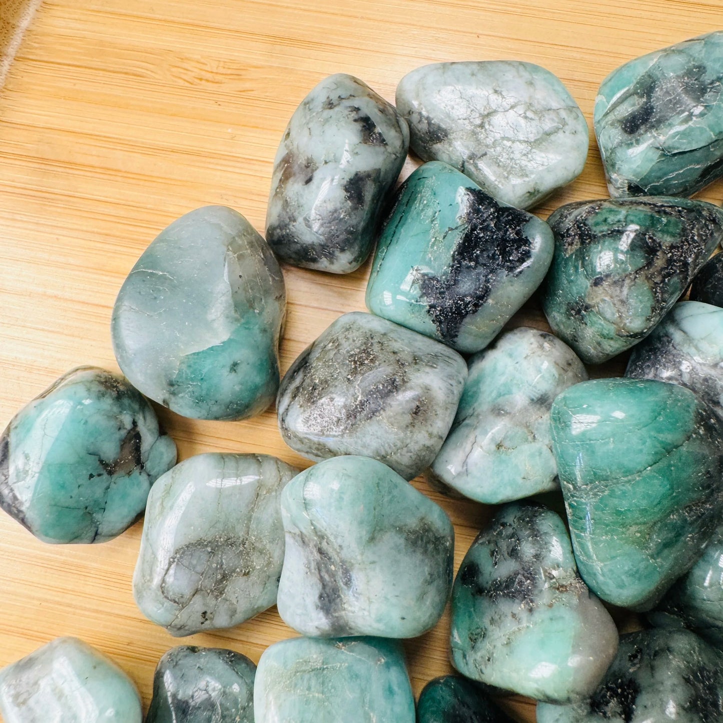 Full profile of Grade AA Emerald tumbled stone ready to ship from Beyond Bohemian
