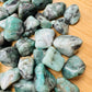 Full profile of Grade AA Emerald tumbled stone ready to ship from Beyond Bohemian