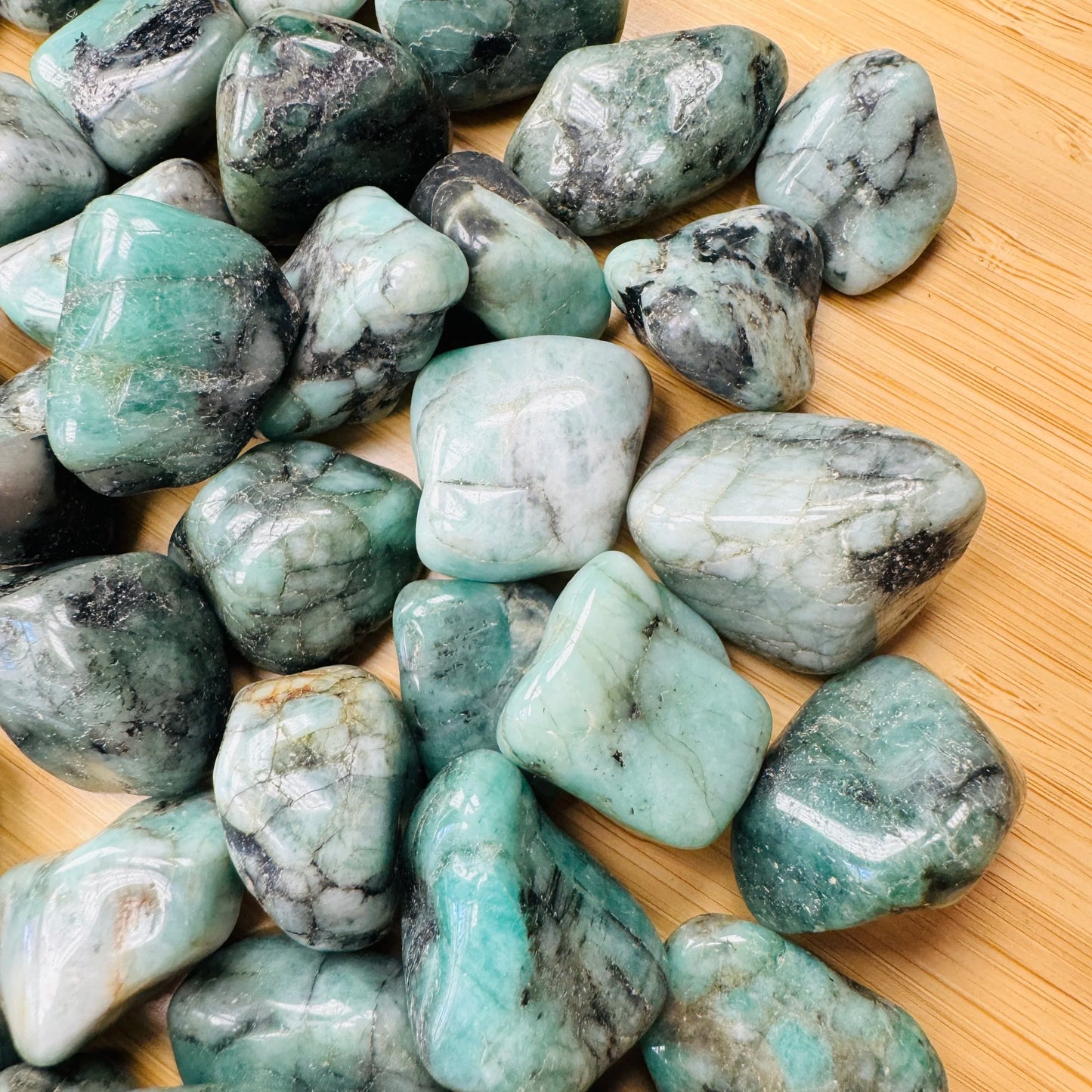 Full profile of Grade AA Emerald tumbled stone ready to ship from Beyond Bohemian