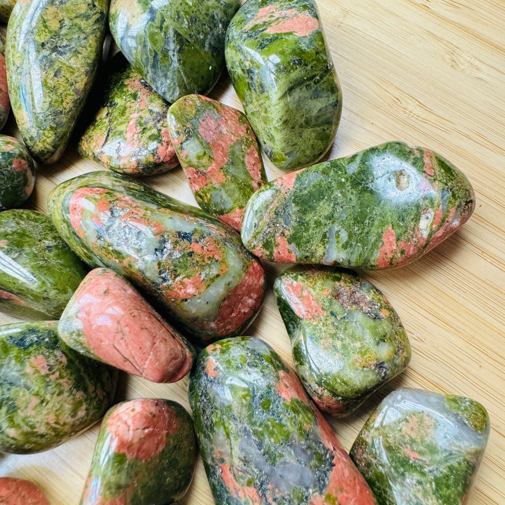 Top angle of Unakite tumbled stone, hand-selected from Northern Cape, South Africa, showing characteristic finish.
