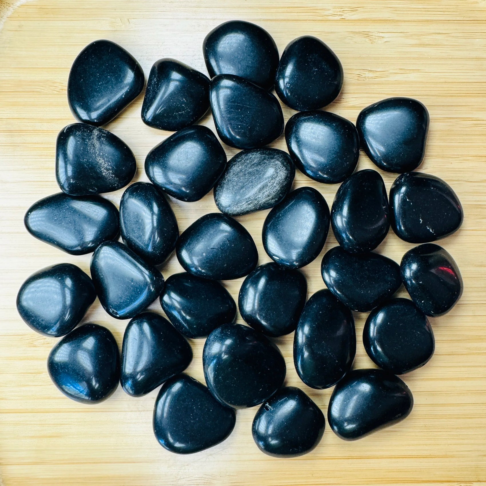 Black Obsidian tumbled stone in Black tones, ethically sourced from Argentina for Emotional Healing and Cleansing