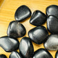 Aerial view of Grade AA Black Obsidian tumbled stone, for Protection and Grounding, sourced from Argentina.