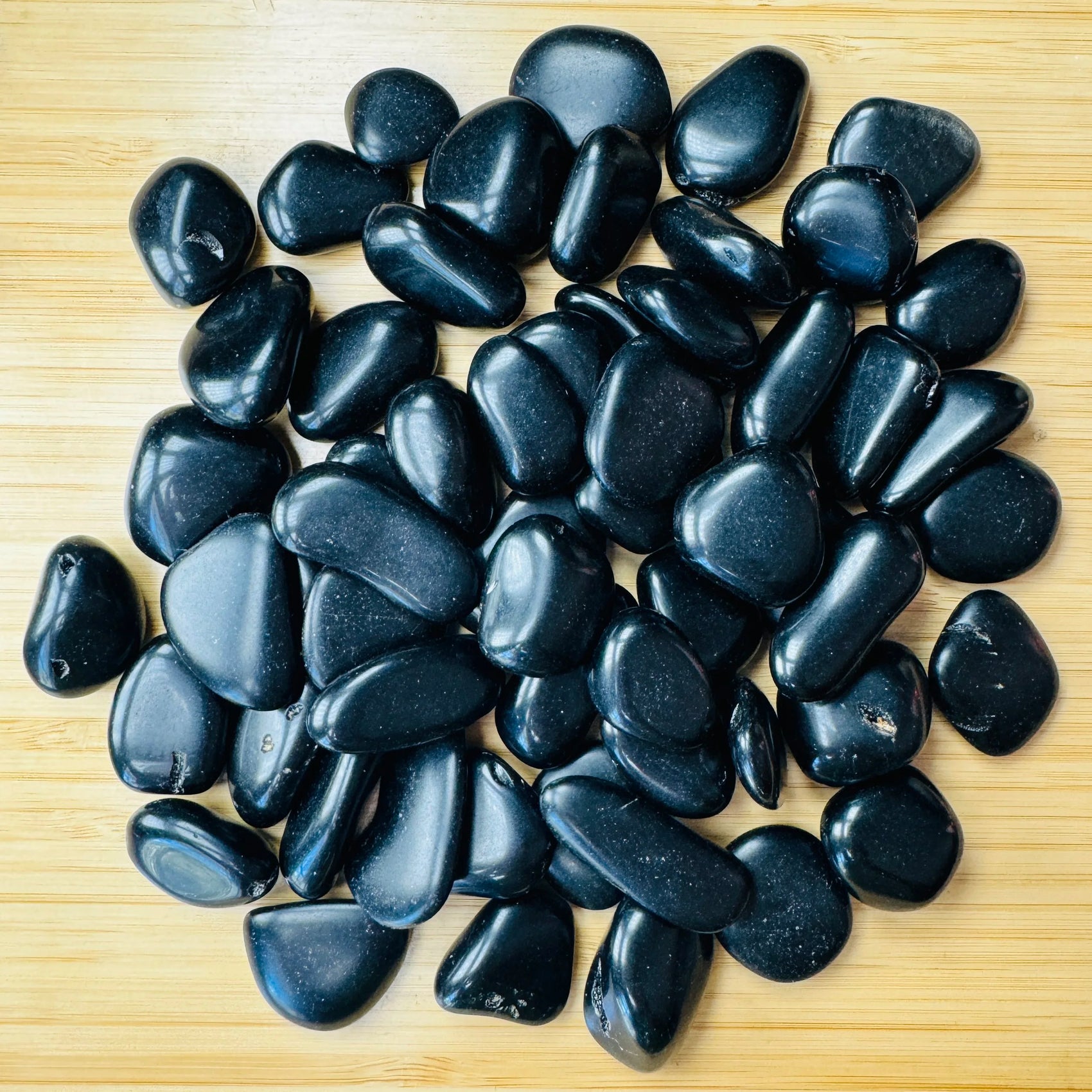 Black Obsidian tumbled stone in Black tones, ethically sourced from Argentina for Emotional Healing and Cleansing