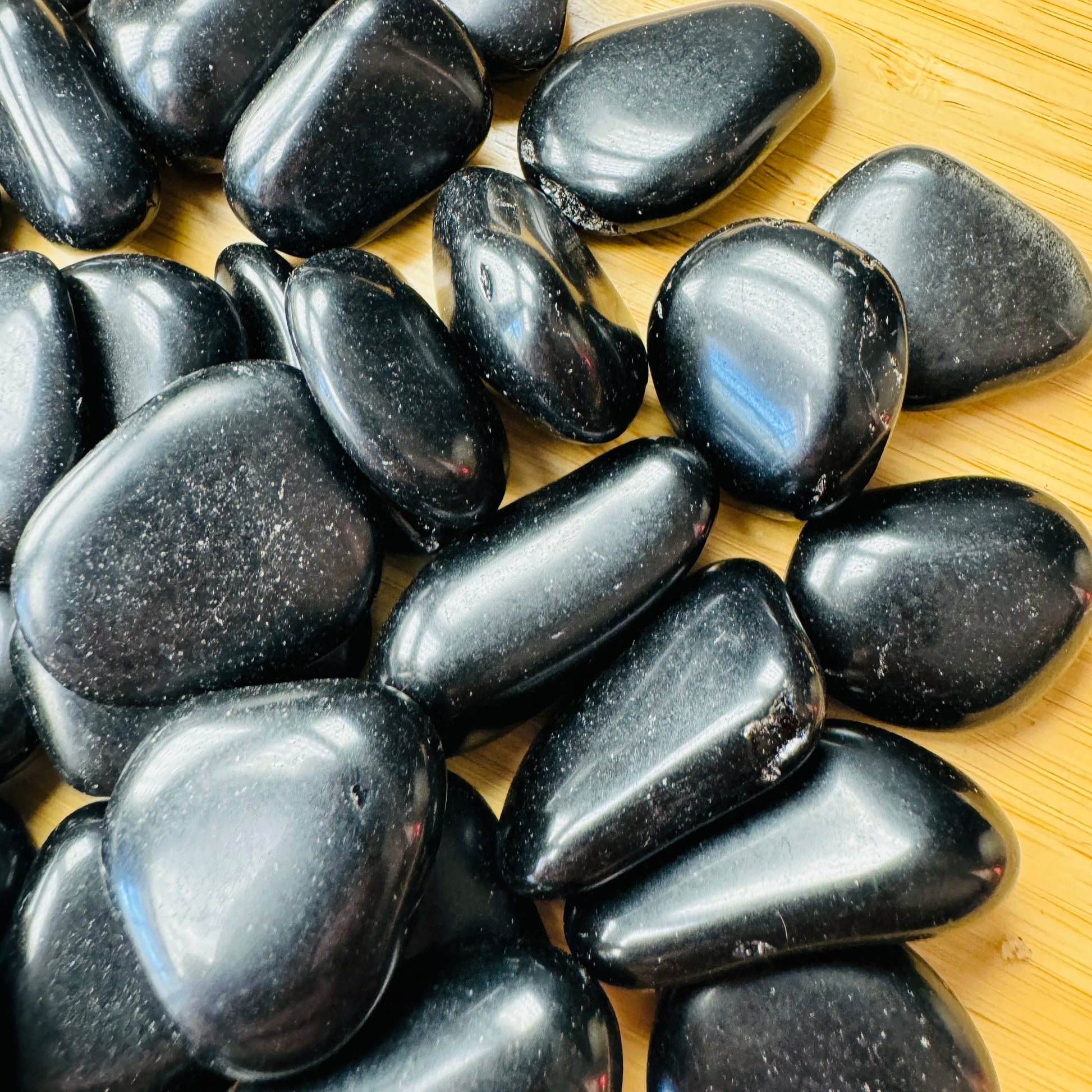 Reverse side of Black Obsidian tumbled stone, traditionally used for Protection, from Salta Province, Argentina.