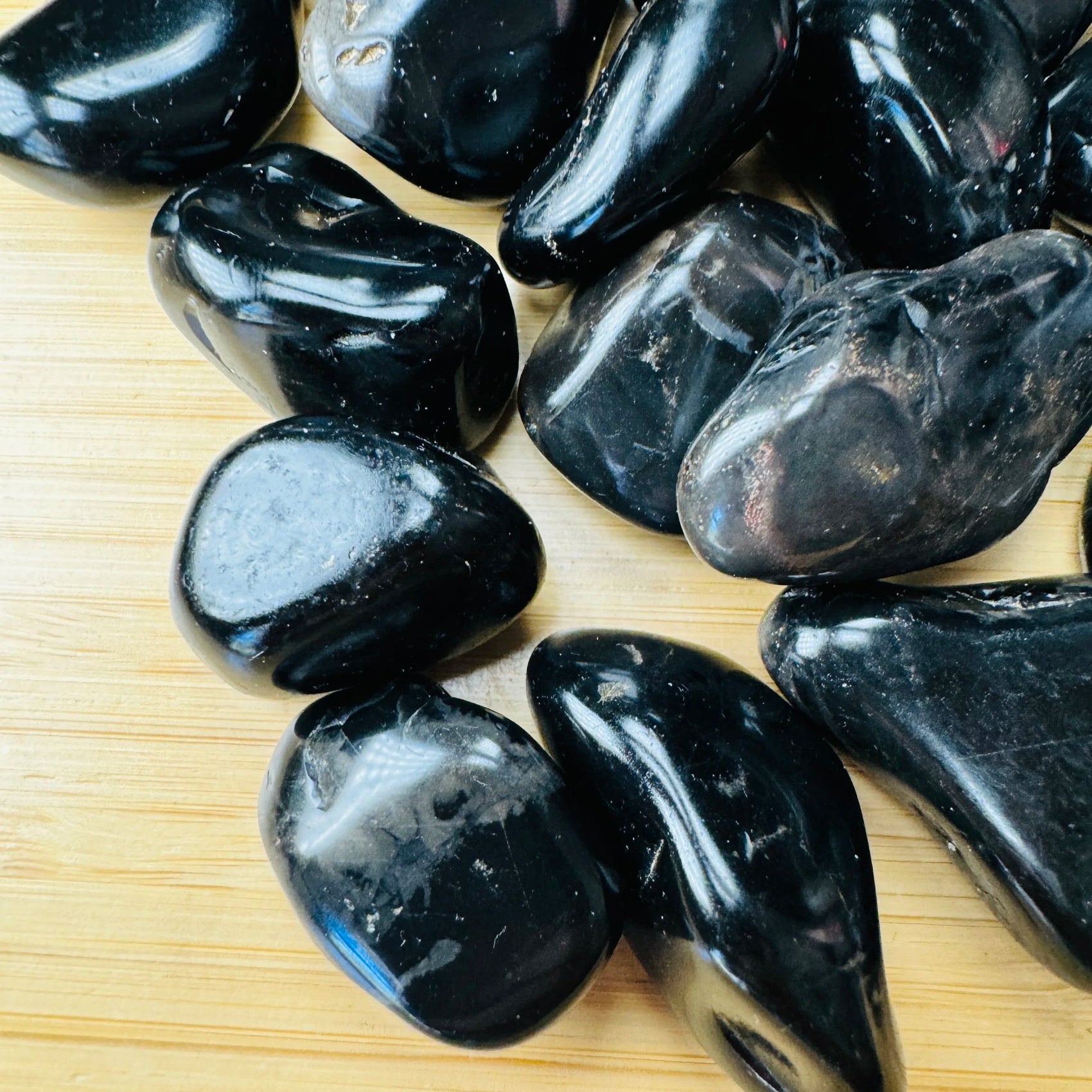 Rear view of Black Onyx tumbled stone, often worked with for Protection and Grounding.