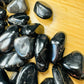 Black Onyx tumbled stone from Brazil with Black color, polished finish for mindful calm