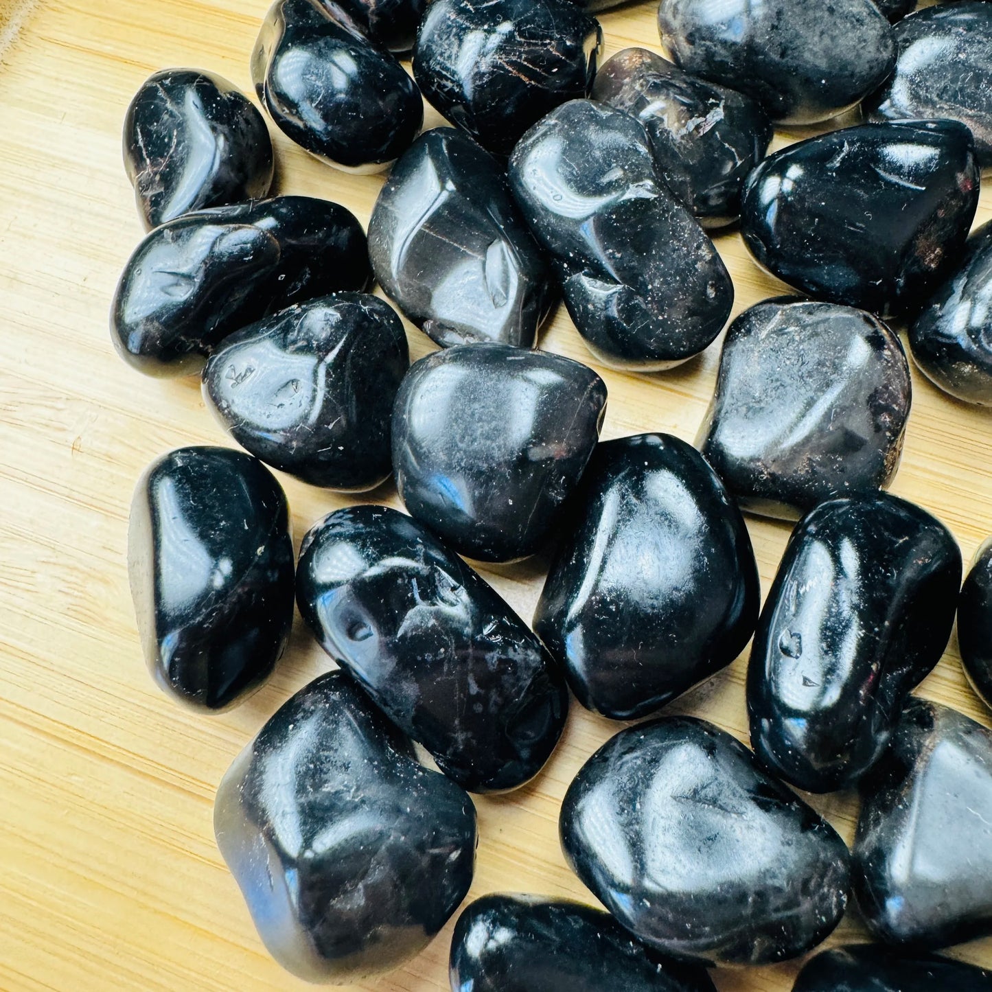 Black Onyx tumbled stone from Brazil with Black color, polished finish for mindful calm