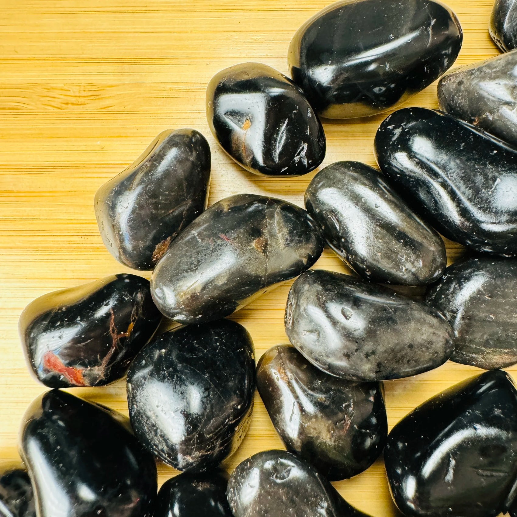 Handheld Black Onyx tumbled stone from Brazil for meditation, Protection and Focus