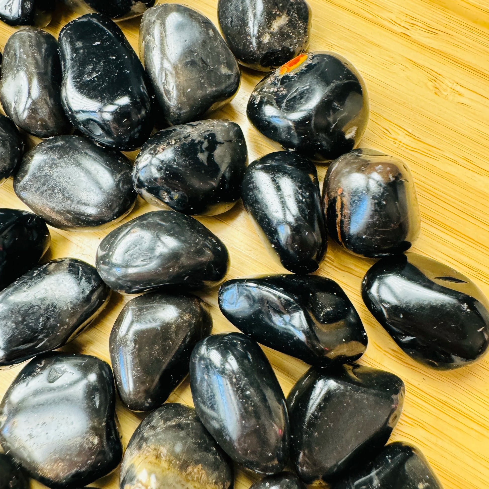 Bulk Black Onyx tumbled stones from Brazil, Black stones for Protection