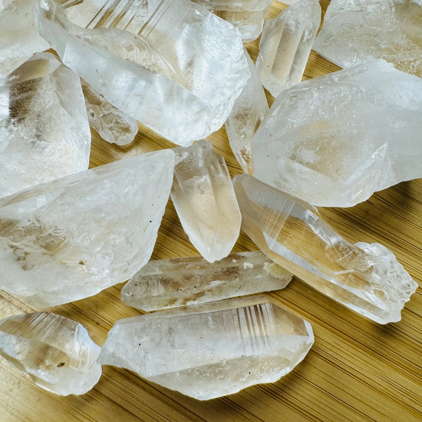 Close-up detail of Grade AA Lemurian Quartz point showing natural clear tones and texture
