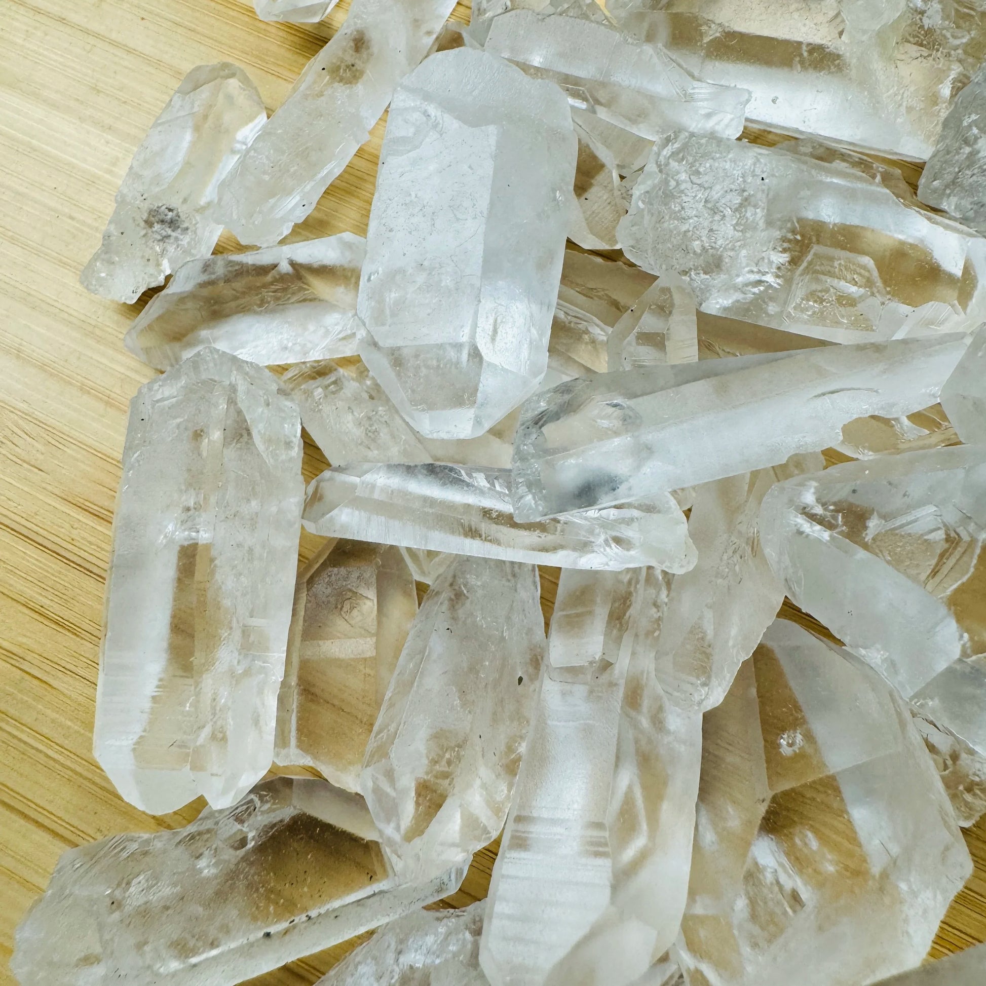Side profile of Grade AA Lemurian Quartz point with natural form and inclusions