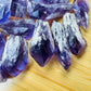 Side-on view of Grade AAA Amethyst raw point, from Brazil, showing tight grain.