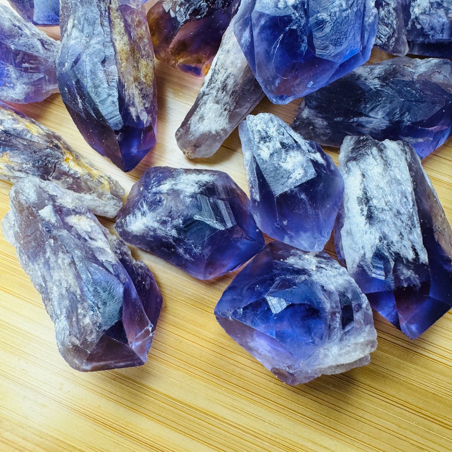 Overhead view of Grade AAA Amethyst raw point, showing raw matrix, associated with Stress Relief.