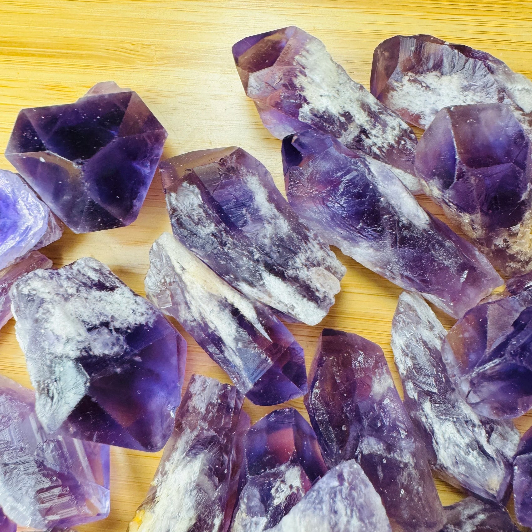 Palm-scale view of a single Amethyst raw point sourced from Bahia, Brazil.