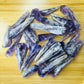 Surface detail of Amethyst raw point, showing natural color depth, turned to for Stress Relief and Sleep.