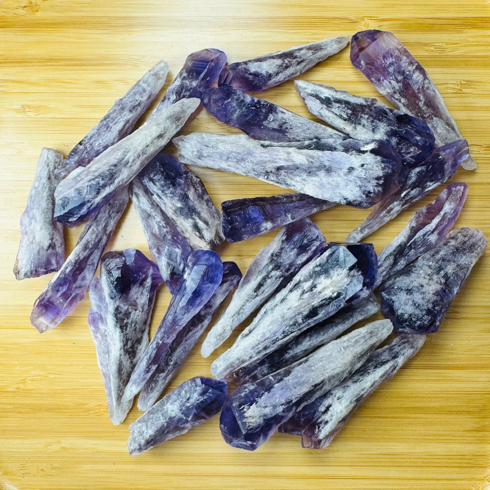 Surface detail of Amethyst raw point, showing natural color depth, turned to for Stress Relief and Sleep.