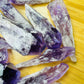 Side-on view of Amethyst raw point, sourced from Bahia, Brazil, traditionally used for Stress Relief and Sleep.