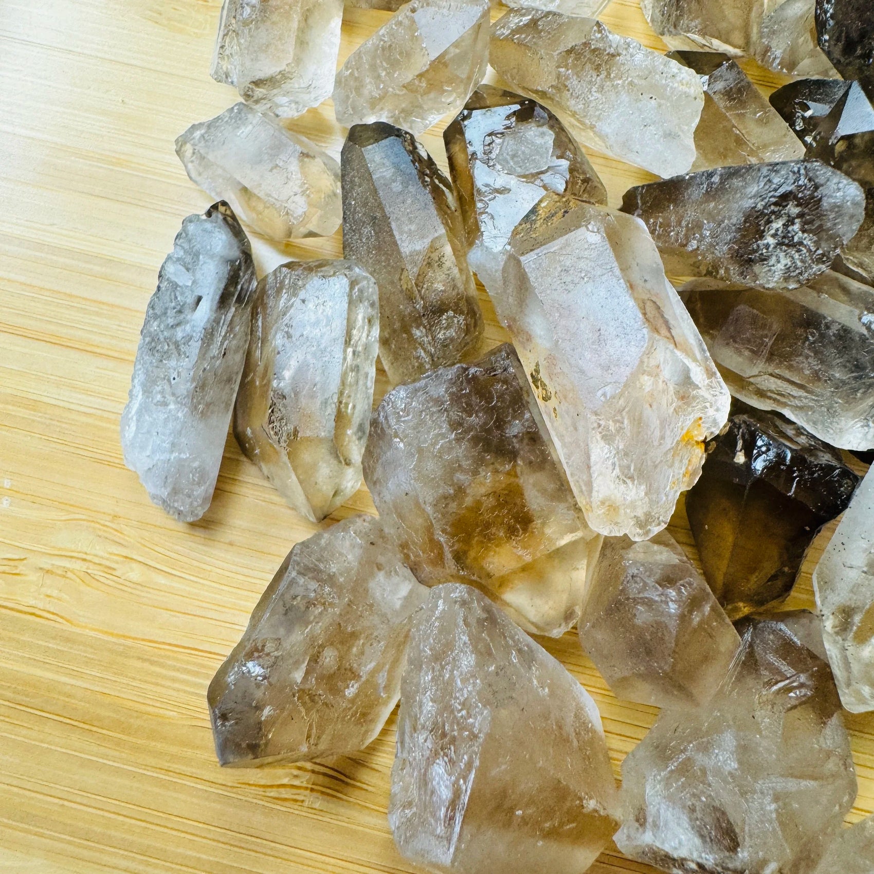 Profile view of Smoky Quartz raw point, showing natural sheen.