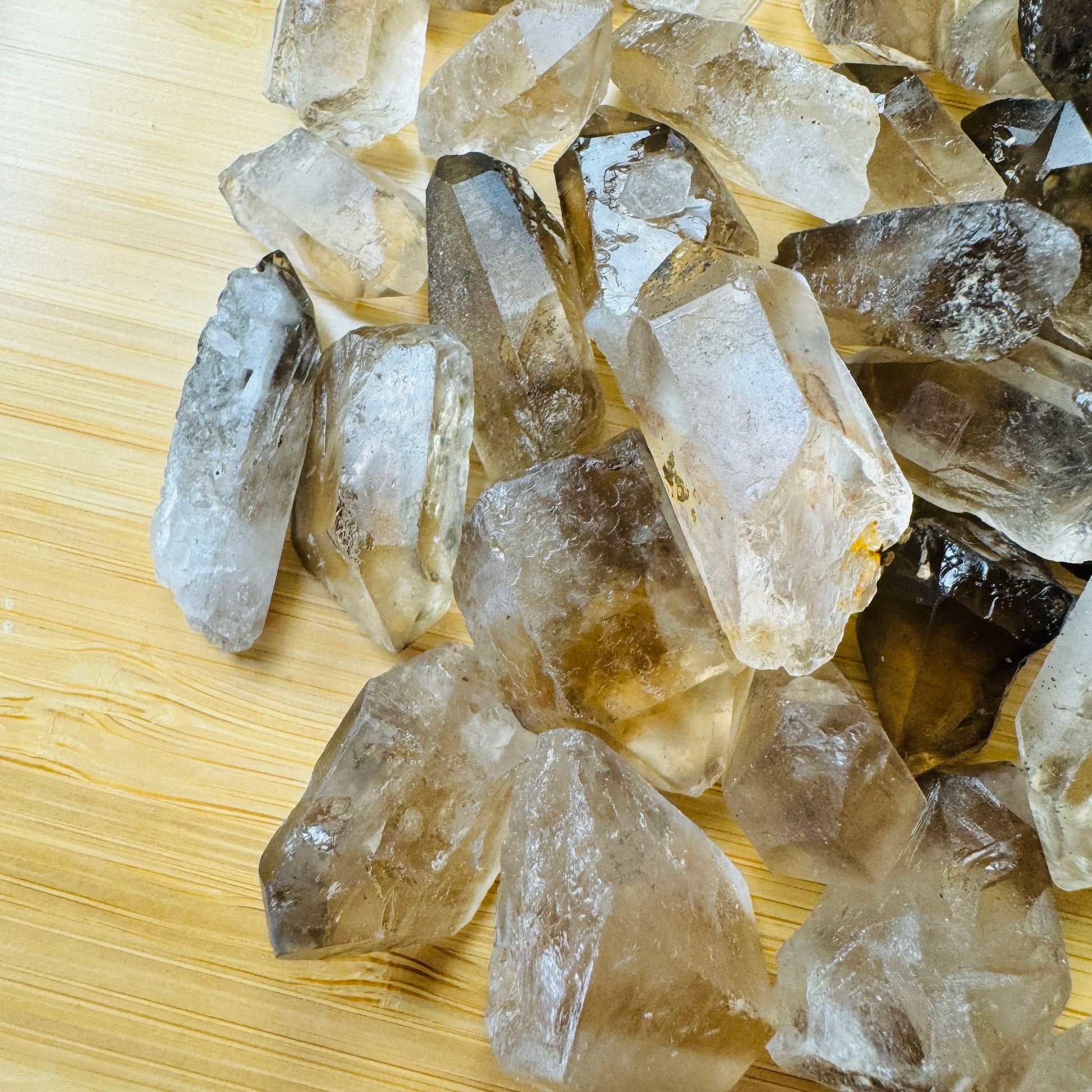 Profile view of Smoky Quartz raw point, showing natural sheen.