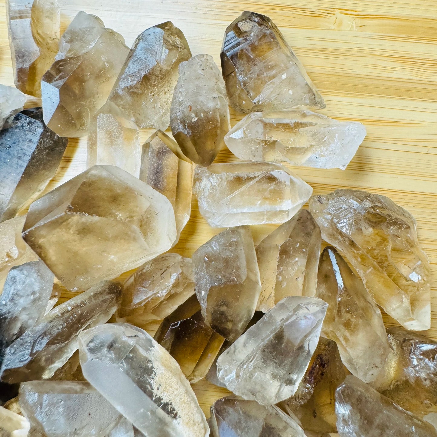 Reverse angle of Smoky Quartz raw point, showing natural patina, sourced from Minas Gerais, Brazil.