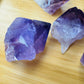 Natural light view of a Amethyst raw point for Stress Relief.