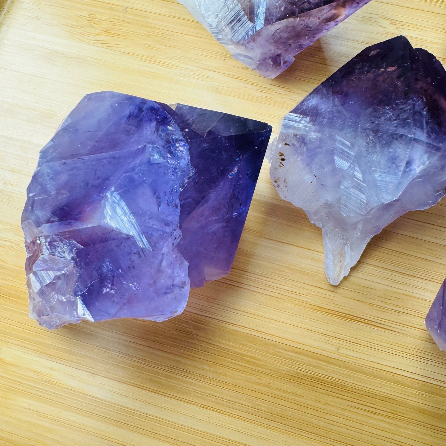 Natural light view of a Amethyst raw point for Stress Relief.