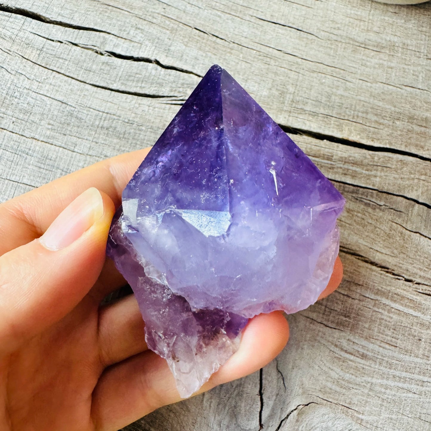 Back view of Grade AAA Amethyst point showing natural surface