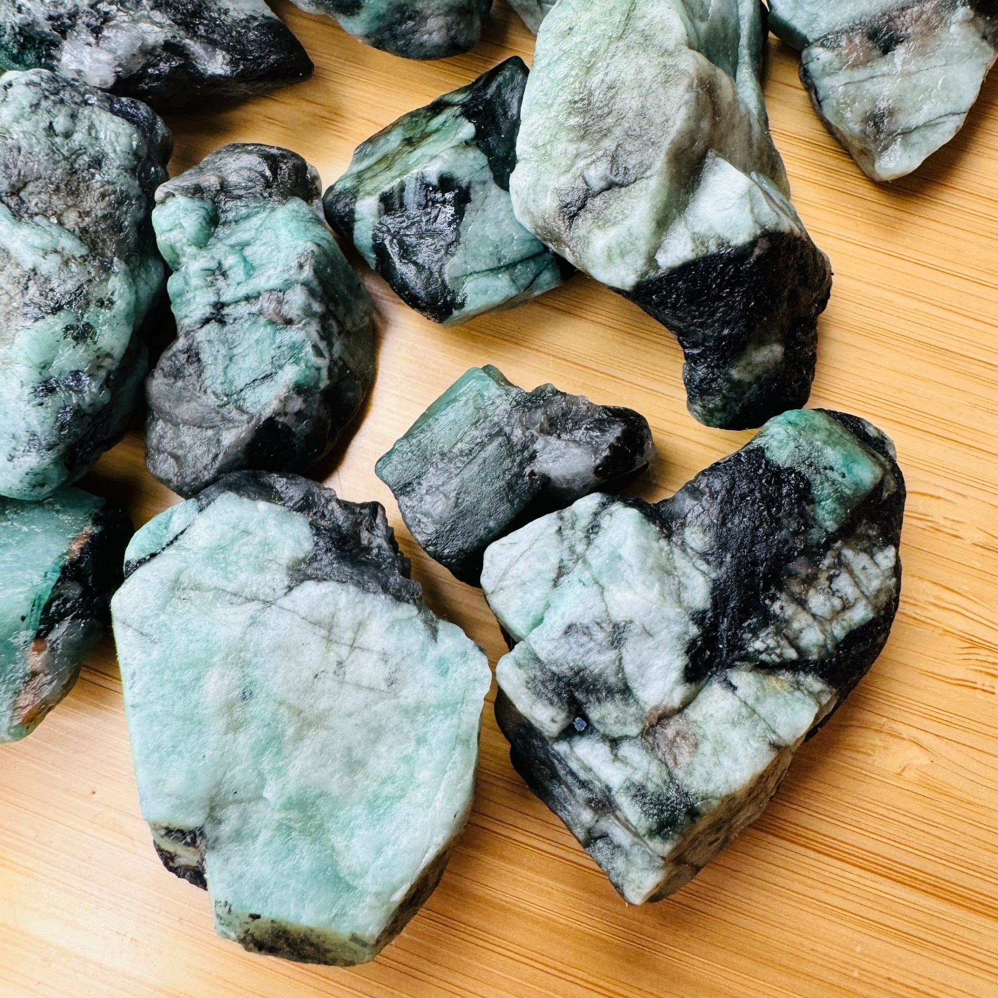 Color detail of green Emerald raw stone, sourced from Bahia, Brazil, showing characteristic finish.