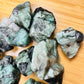 Underside view of Grade AA Emerald raw stone, kept close for Love, sourced from Brazil.