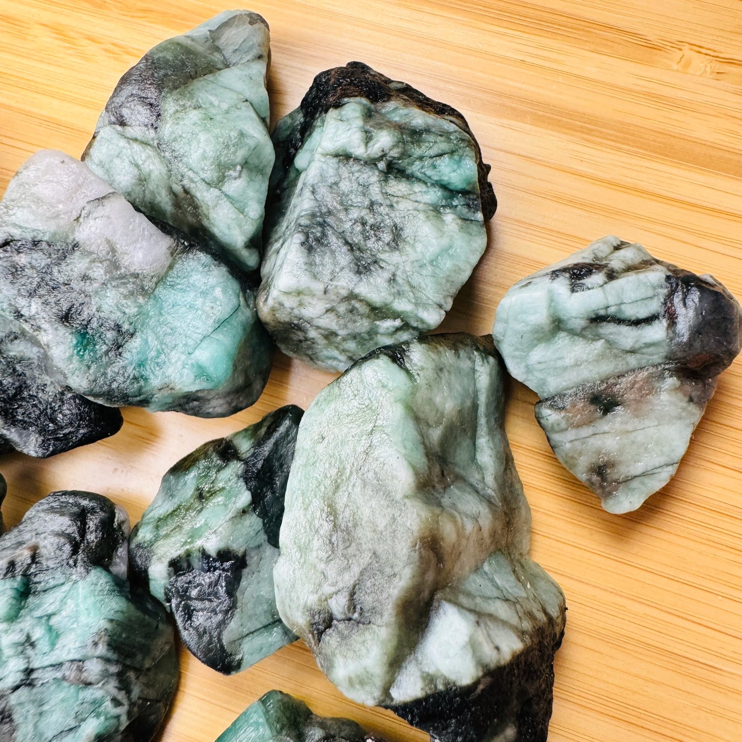 Underside view of Grade AA Emerald raw stone, kept close for Love, sourced from Brazil.