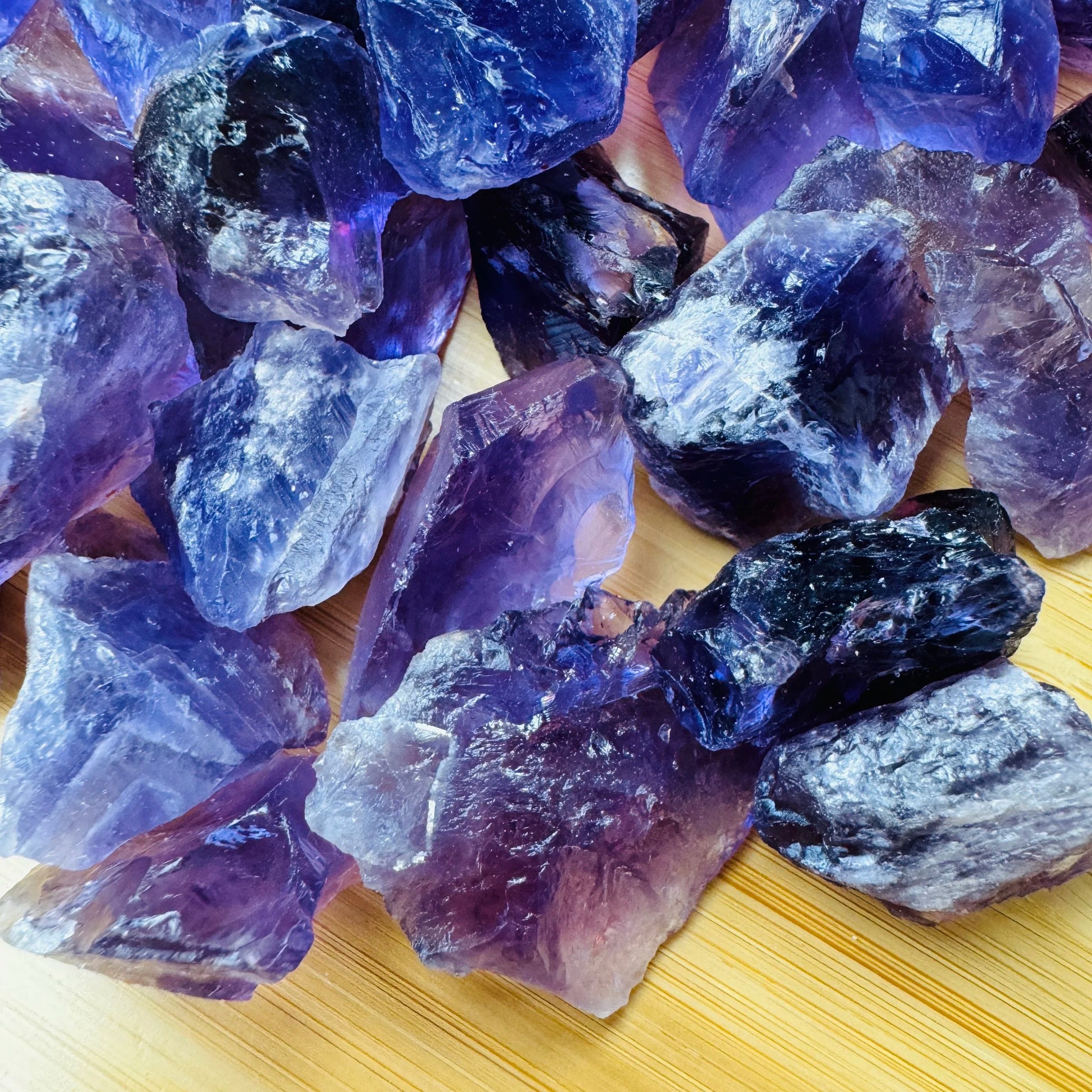 Held in hand, a single Amethyst raw stone sourced from Brazil.