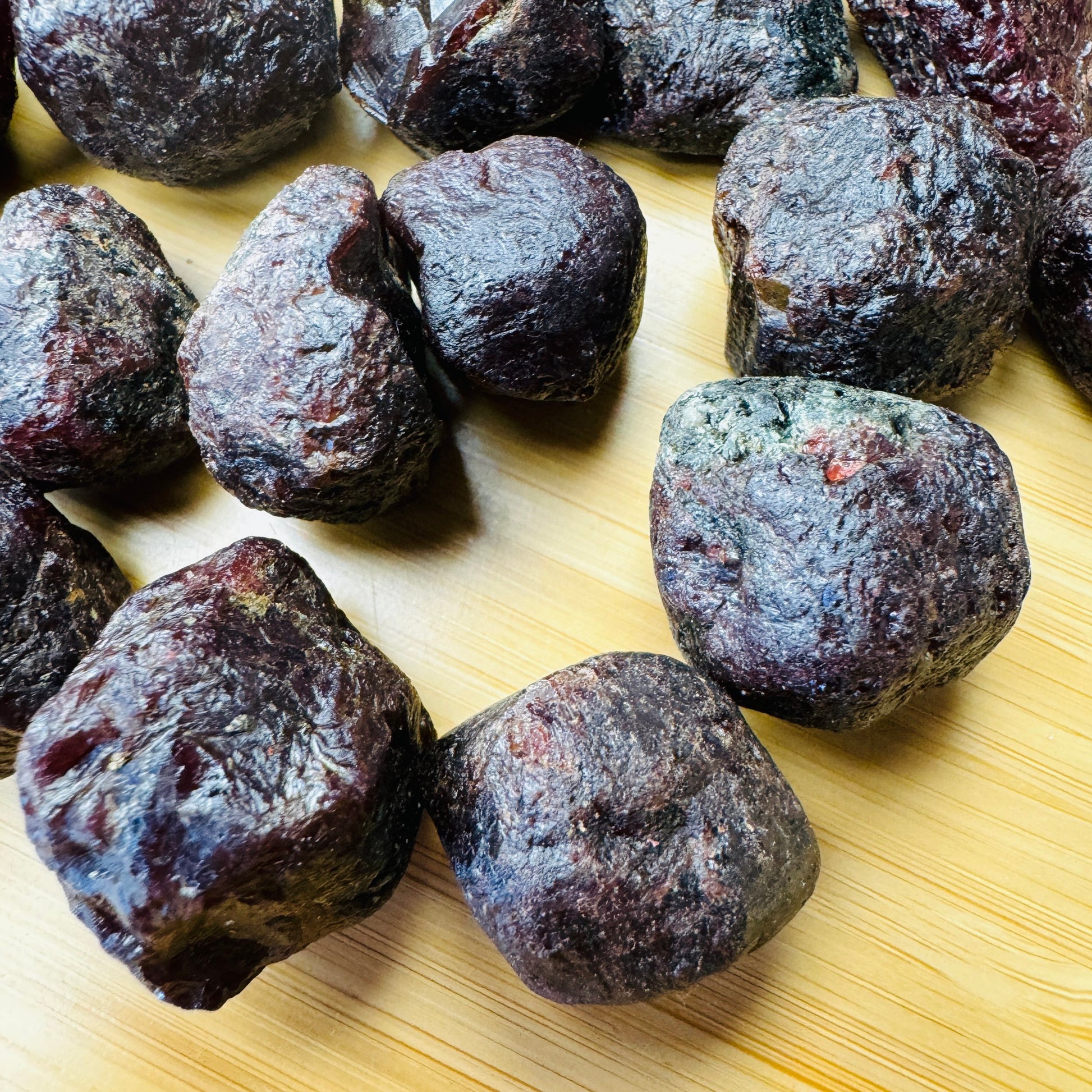 Side profile of Garnet raw stone, often paired with practices around Energy, hand-selected from Paraíba, Brazil.