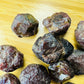 Back view of Garnet raw stone, often kept for Energy.
