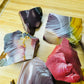 Close detail of raw Mookaite jasper showing banded earth tones, Australian origin