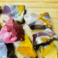Grouping of raw Mookaite jasper, Grade AA, natural ochre and burgundy patterning