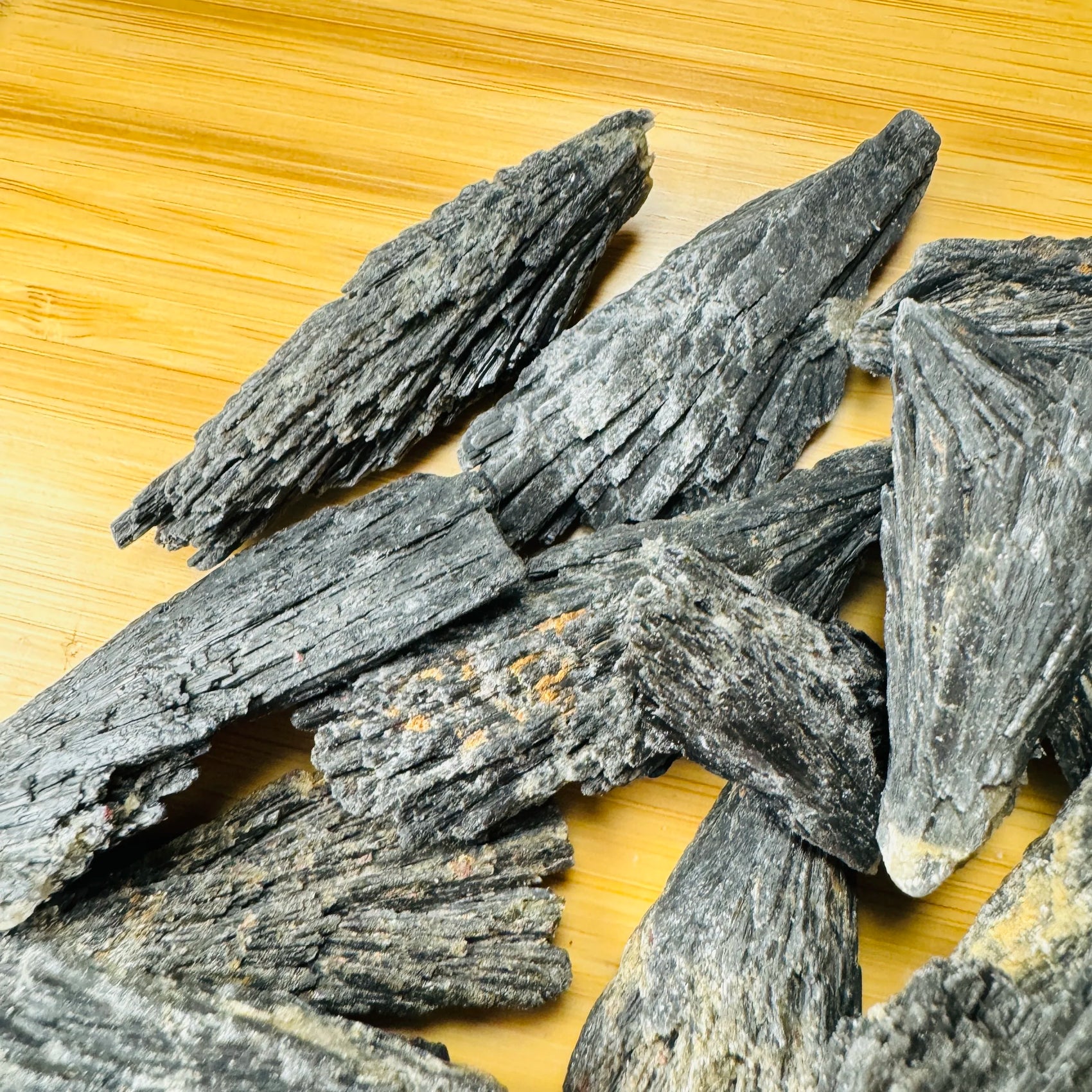 Close-up of Black Kyanite raw crystal from Brazil, soothing wellness stone for Stress Relief