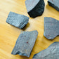 Underside view of Hematite raw stone, showing natural sheen, Brazil-sourced.