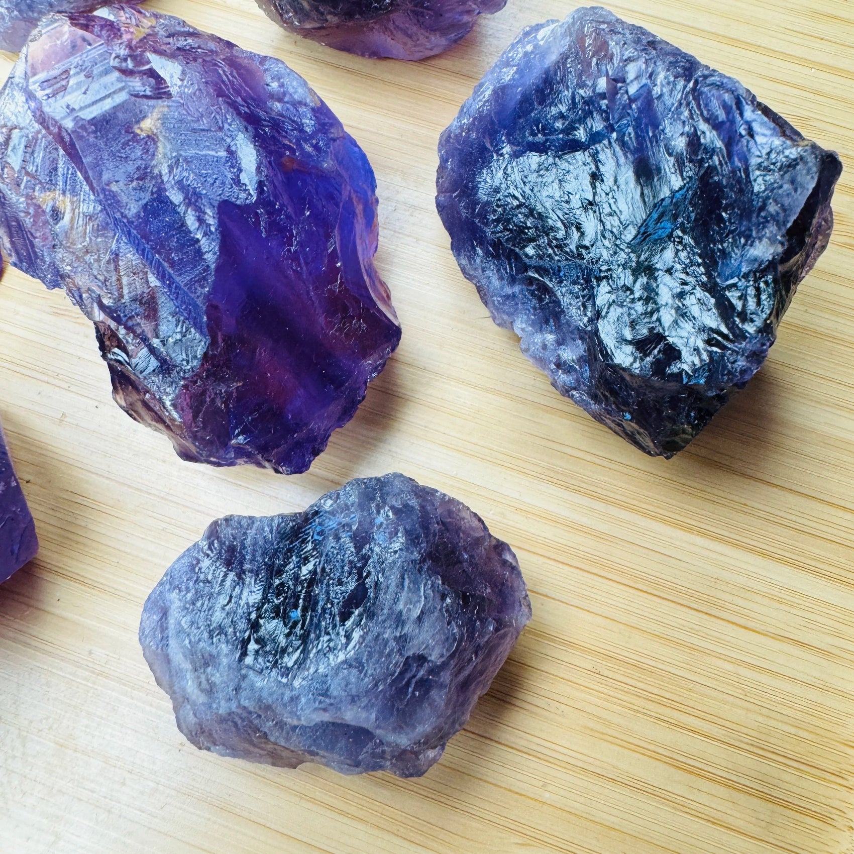 Lateral view of Grade AA purple Amethyst raw stone, hand-selected from Rio Grande do Sul, Brazil, showing natural variation.