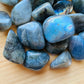 Profile view of Labradorite tumbled stone, sourced from Madagascar, showing natural variation.