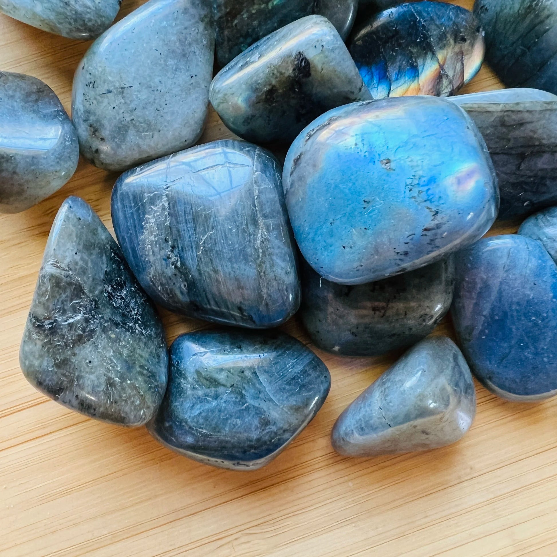 Profile view of Labradorite tumbled stone, sourced from Madagascar, showing natural variation.