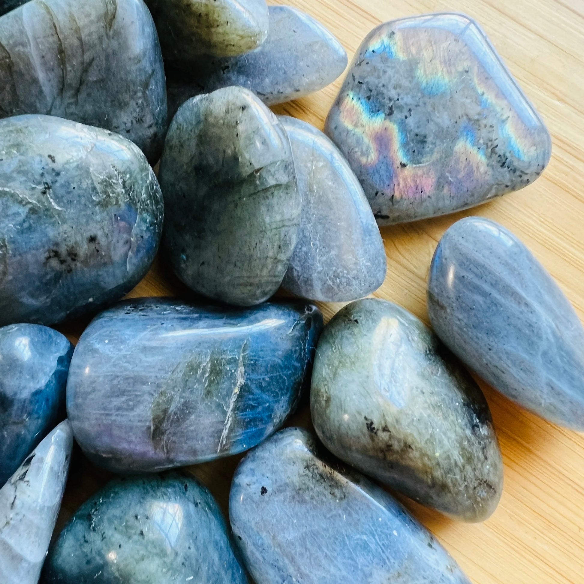 Magnified detail of Labradorite tumbled stone, showing color depth, sourced from Madagascar.